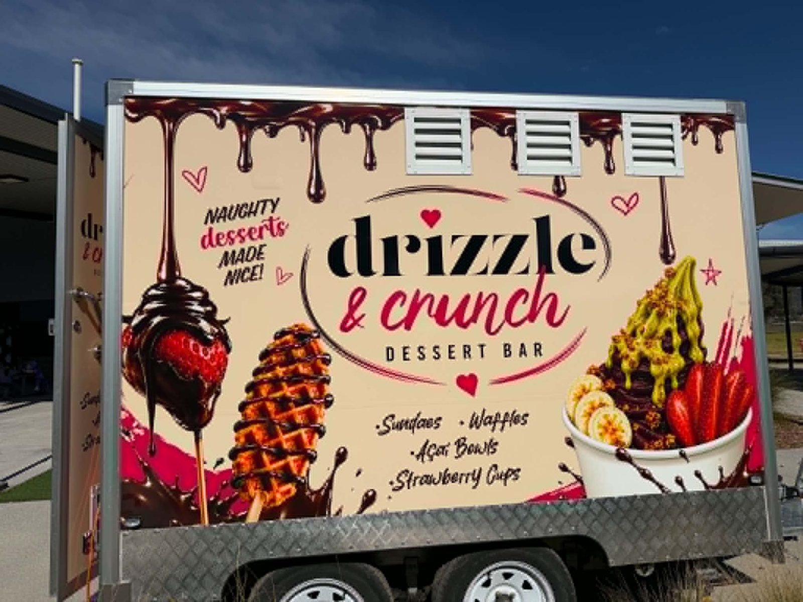 The Drizzle & Crunch van closed up, showing the full chocolate-drip wrap